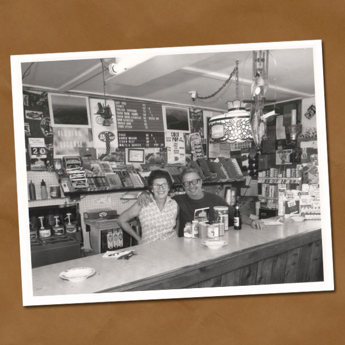 Black and white photo of two women behind counter at Tally's Dockside