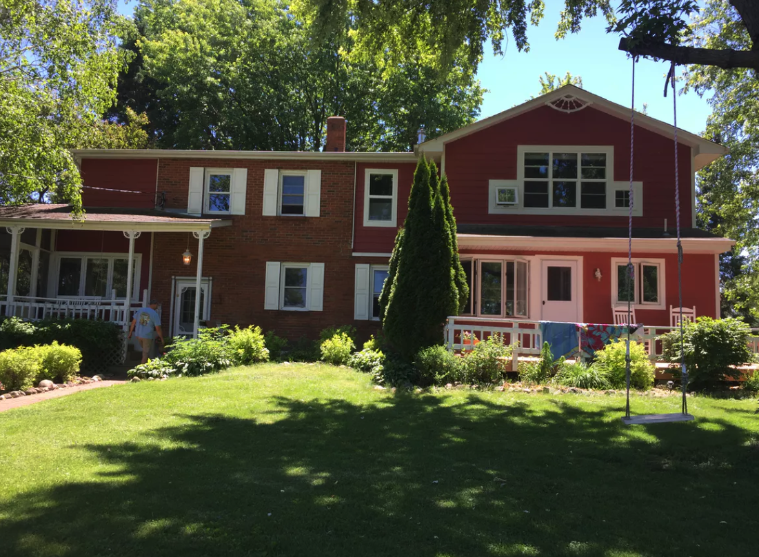Brick farmhouse and lawn exterior