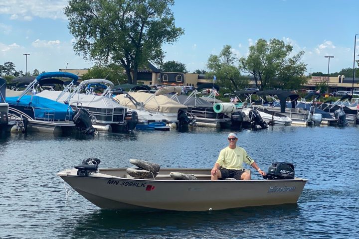 a group of people in a boat on a body of water