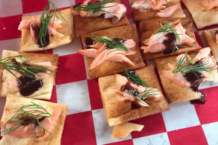 a table topped with a sandwich and a salad