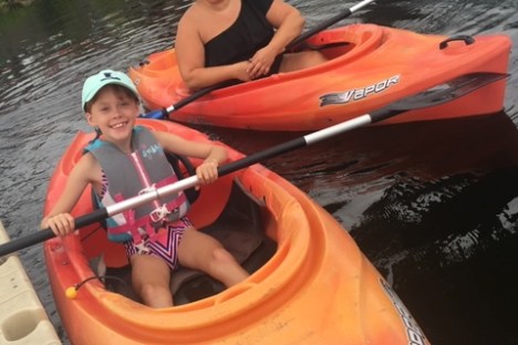 a person sitting on a raft in the water