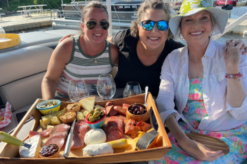 a woman sitting at a picnic table